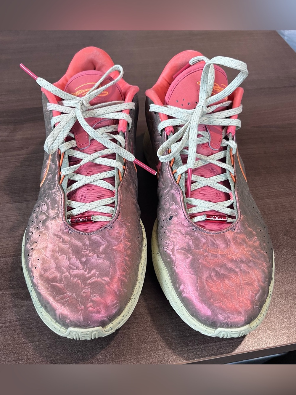Nike LeBron XXI "Queen Conch" sneakers featuring a metallic Ember Glow upper.